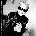 Click here to buy Dark Chords on a Big Guitar by  Joan Baez .