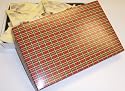 Scott's Cakes 1 lb. White Chocolate Almond Bark in a Christmas Plaid Box