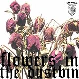 Flowers In The Dustbin