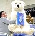 LUXURIOUS GIANT STUFFED POLAR BEAR - COMES WITH 1-POUND BOX OF PERUGINA CHOCOLATES ATTACHED TO RIBBON BOW AROUND NECK - 42-INCHES LONG Image