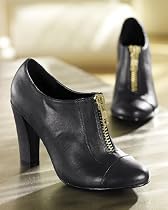Newport News Shoe boot with bold, golden front zipper