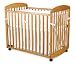 Alpha Mini Rocking Crib in Honey Oak Finish By Da Vinci Baby Furniture