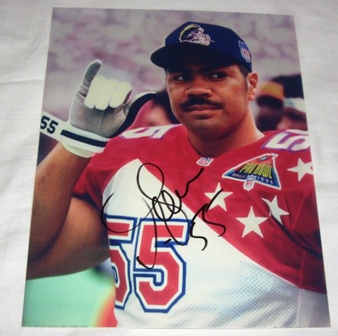 Junior Seau Autographed San Diego Chargers Pro Bowl 8x10 Photo W/PROOF, Picture of Junior Signing For Us, Miami Dolphins, New England Patriots