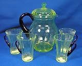 Fenton Vaseline Glass Covered Pitcher