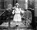 Photographic Prints of SPIRIT PHOTOGRAPH, c1905. A young girl holding flowers, surrounded by spectral from Granger Art on Demand