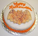 Carrot Decorated Cake Single Layer 8 Round Topped with Bat Cookie Orange Trim