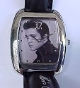 Elvis portrait man's size watch.Shinny silver tone case with black leather band. Rectangular shape, size 1.5 x 1.1.25 inches ref:E8036