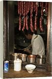 Box Canvas Print of Hanging sausages in window of restaurant kitchen from Robert Harding