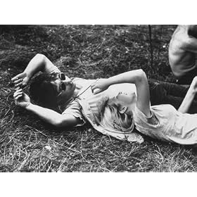 Young Couple Relaxing During Woodstock Music Festival Photographic Poster Print by Bill Eppridge, 16x12