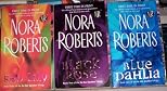 BLUE DAHLIA, BLACK ROSE, RED LILY Nora Roberts (In the Garden Triolgy)
