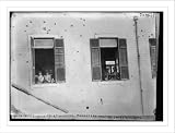 Newswire Photo (L): (Note shots) soldiers at windows of monastery ready to shoot looters