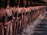 Ancient Buddha Statues Lining Walls of Wat Mahathat in Sukhothai Historical Park, Thailand Photographic Poster Print