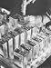 Close Up of Gloved Workman's Hands Using Hammer on Steel Embosser as He Stamps a Batc...