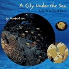 Click here to buy A City Under the Sea: Life in a Coral Reef by  Norbert Wu.