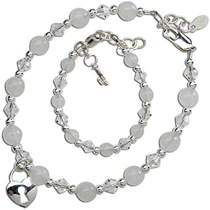 Bracelet set for mother and daughter featuring beautiful white stones and Swarovski crystals. Mother's is adorned with silver heart lock and baby's has the key to her heart. Mother's bracelet is 7-71/2" and the daughter's bracelet is 0-12 Months. A very heart warming gift for any mother and daughter - "She Holds the Key to Your Heart" Bracelets