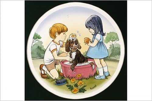 Photographic Print of A boy and a girl wash their pet dog
