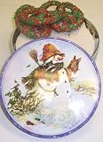 Scott's Cakes 1 lb. White Chocolate Covered Pretzel with Christmas Jimmies in a Classic Snowman Tin