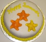 Gourmet Food : Chocolate Decorated Cake Single Layer 8' RoundTopped with Tropical Punch and Orange Starfish Gummies