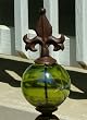 Rustic Iron Fleur de Lis Obelisk with Green Suncatcher Glass Gazing Globe