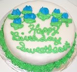 Chocolate-Mango-Chocolate Lovers Cake Topped with Fondant Green Trim and Blue Flowers