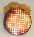 Scott's Cakes Macadamia Nut Brittle in a Plaid Tin