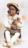 African American Girl Figurine Holding Teddy Bear