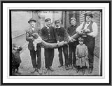 Newswire Photo (XL): Tusk, held by four men, excavated near Pittsburgh