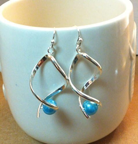 Elegant Twirl Earrings ( Turquoise) + Zebra Jewelry Pouch.