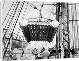 Canvas Prints of The life raft from Elingamite (1887) being hoisted off the upper deck from National Maritime Museum
