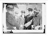 Newswire Photo (S): C. Comiskey & recruits outfielder Wilfred H. Genest with catchers Thomas Carney & Wally