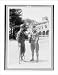 Historic Print (L): [At Walter Reed Hospital, a soldier who is missing a foot lights ...
