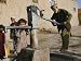 An Elderly Man Pumps Water from a Public Well in Kabul, Afghanistan, Friday, Septembe...