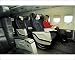 Photographic Prints of Female passenger in business class on MDC MD83 AOM airliner from Flightglobal