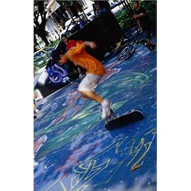 photographie A young skateboard rider executing some fancy moves at the skate park near the Natio...