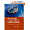 Experimental Techniques: Cryostat Design, Material Properties and Superconductor Critical-Current Testing
