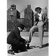 Model Showing Off Slacks as She Reads a First Aid Text Book in Washington Square Park Photographic Poster Print by Nina Leen, 12x16