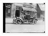 Newswire Photo (L): G.G. Bain in auto in front of restaurant No. 32 (No. 34 Japan Paper Co.)