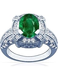 Platinum Oval Cut Emerald Ring With Sidestones