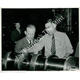 Vintage Photo- Men examine airplane part