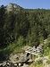 Hikers on Bridge in Hiking Area of Pic De Coma Pedrosa, Parish of La Massana, Andorra, Pyrenees Photographic Poster Print by Christian Kober, 12x16