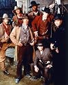 MICHAEL BIEHN AS CHRIS LARRABEE, ERIC CLOSE AS VIN TANNER, ANDREW KAVOVIT AS JOHN "J.D." DUNNE, DALE MIDKIFF AS BUCK WILMINGTON, RON PERLMAN AS JOSIAH SANCHEZ, ANTHONY STARKE AS EZRA STANDISH, RICK WORTHY AS NATHAN JACKSON FROM THE MAGNIFICENT SEVEN #1 - COLOUR Movie Photo - (4 Different Photograph & POSTER Sizes Available)