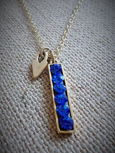 24k gold plated bar necklace with sapphire Swarovski crystals and heart charm.