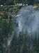 A Firefighting Helicopter Douses a Forest Fire Threatening Homes Photographic Poster ...
