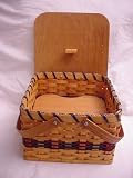 Amish Handmade Square Double Pie Basket with Wood Tray and Lid. Two Wooden Handles. A Beautiful and Well Constructed Basket Made Especially to Transport Those Delicate Homemade Pies Safely. Sitting Out on Your Cabinet or Dining Table This Basket Adds Just the Right Touch to Your Country Kitchen Decor. This Handmade Basket Has Many Uses Beyond Carrying Pies In. Colors May Vary (Brown, Black, Red, Blue, Green, Purple, Burgundy, Natural)