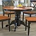 Home Styles Round Pedestal Casual Dining Table in Black and Cottage Oak Finish