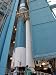 Solid Rocket Booster Being Moved into Place Alongside the Delta II First Stage Art Ph...