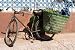 Old Bicycle Leaning against Wall with Panniers on - Peel and Stick Wall Decal by Wallmonkeys