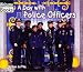 A Day With Police Officers (Welcome Books)