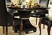 American Drew Bob Mackie Signature Feather Round Casual Dining Table in Dark Cherry Finish