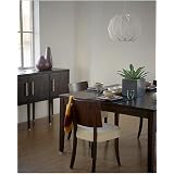 Modern dining room with dark furniture by Arcaid